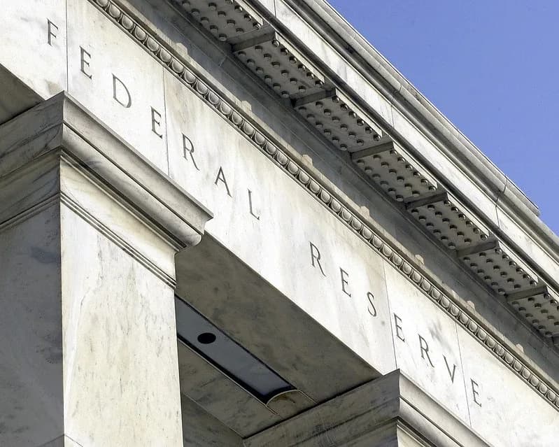 The words Federal Reserve carved into the stone facade of the Federal Reserve building
