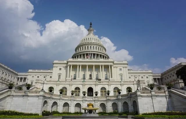 The west front of the United States Capitol under a blue sky